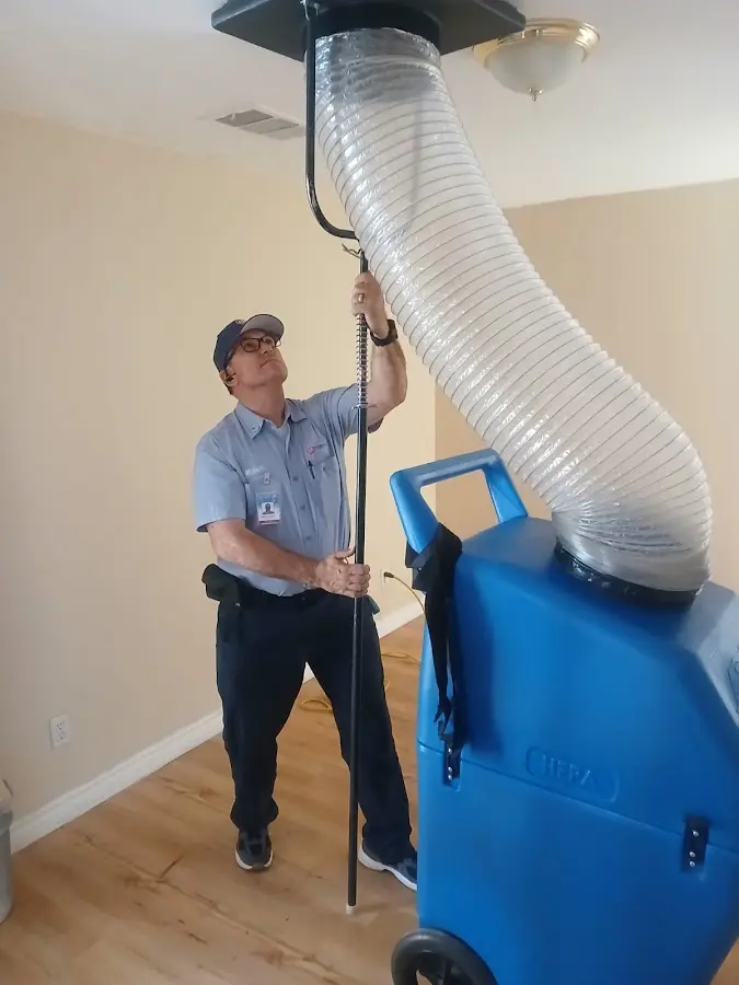 Furnace Tune-Up technician using HEPA equipment in Wade Hampton